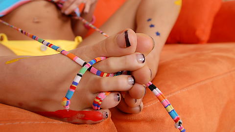 Licking her own french manicure toes